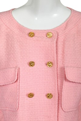 Lot 49 - A Chanel by Karl Lagerfeld pink bouclé suit, circa 1987-88