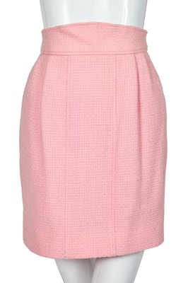 Lot 49 - A Chanel by Karl Lagerfeld pink bouclé suit, circa 1987-88