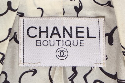 Lot 39 - A Chanel by Karl Lagerfeld printed silk and black wool ensemble, Spring-Summer 1993
