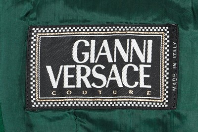 Lot 300 - A Gianni Versace green and black bouclé suit, Autumn-Winter 1993-94