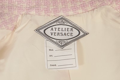 Lot 302 - A Gianni Versace haute couture pink tweed suit, circa 1994