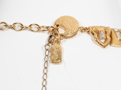 Lot 79 - An Yves Saint Laurent gilt and rhinestone necklace and earrings, late 1970s-80s