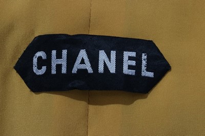 Lot 232 - A Chanel couture gold lurex-weave jacket, 1969,...