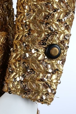 Lot 232 - A Chanel couture gold lurex-weave jacket, 1969,...