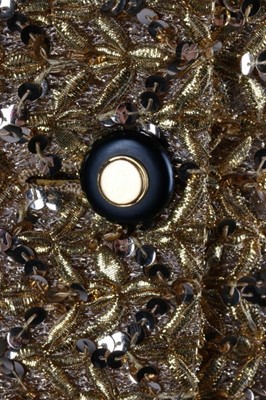 Lot 232 - A Chanel couture gold lurex-weave jacket, 1969,...