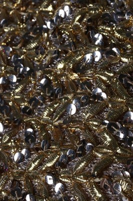 Lot 232 - A Chanel couture gold lurex-weave jacket, 1969,...