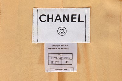 Lot 21 - A Chanel by Karl Lagerfeld peach and brown silk and tweed ensemble, Cruise 2001