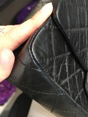 Lot 12 - A Chanel 2.55 Reissue black leather flap bag, 2009-2010