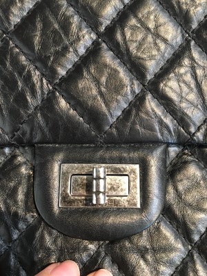 Lot 12 - A Chanel 2.55 Reissue black leather flap bag, 2009-2010