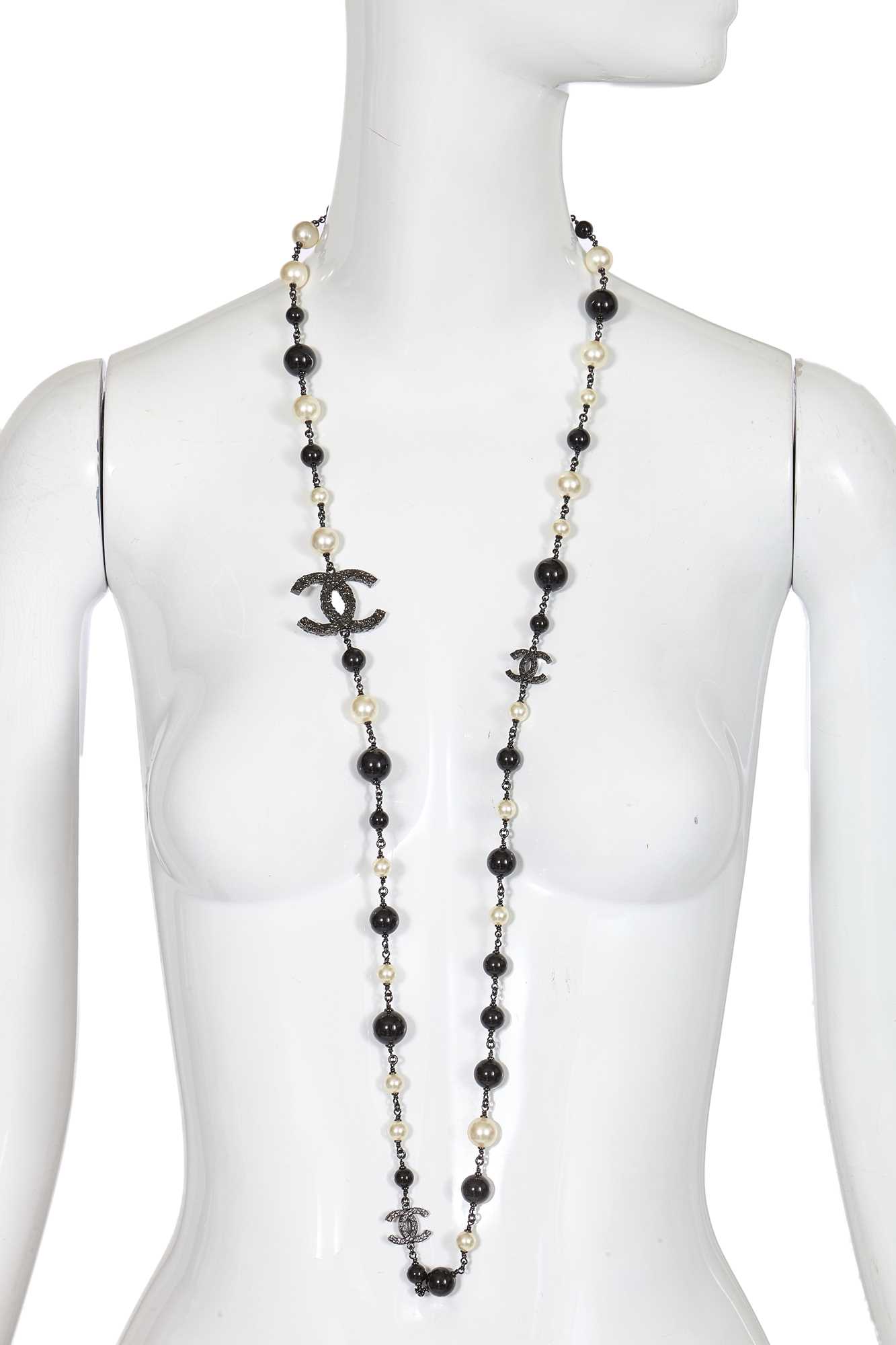 Lot 11 - A Chanel by Karl Lagerfeld black bead and faux pearl sautoir, Spring-Summer 2011