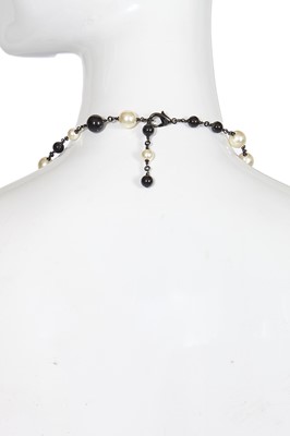 Lot 11 - A Chanel by Karl Lagerfeld black bead and faux pearl sautoir, Spring-Summer 2011