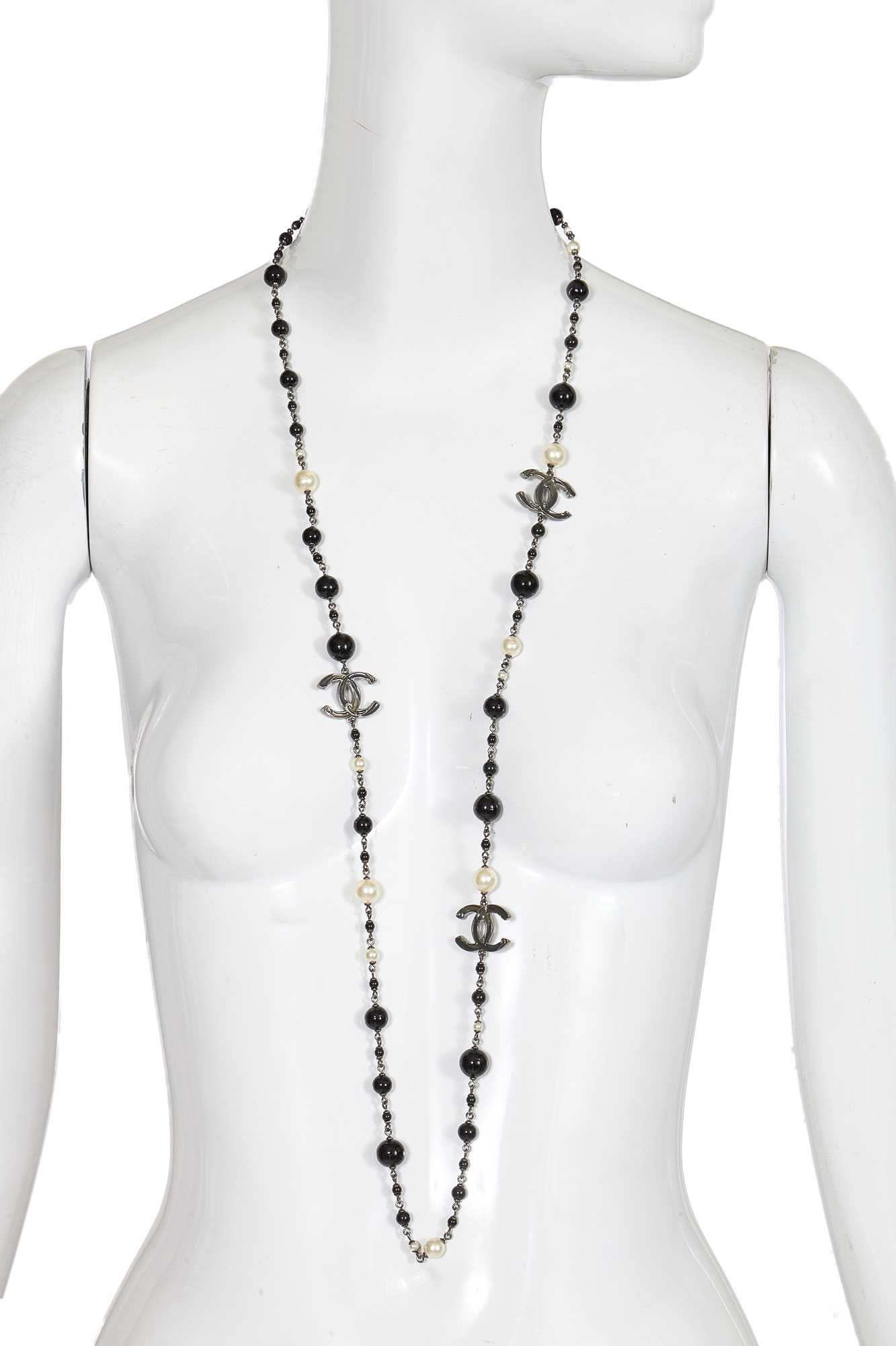 Lot 13 - A Chanel by Karl Lagerfeld black bead and faux pearl sautoir, Spring-Summer 2010