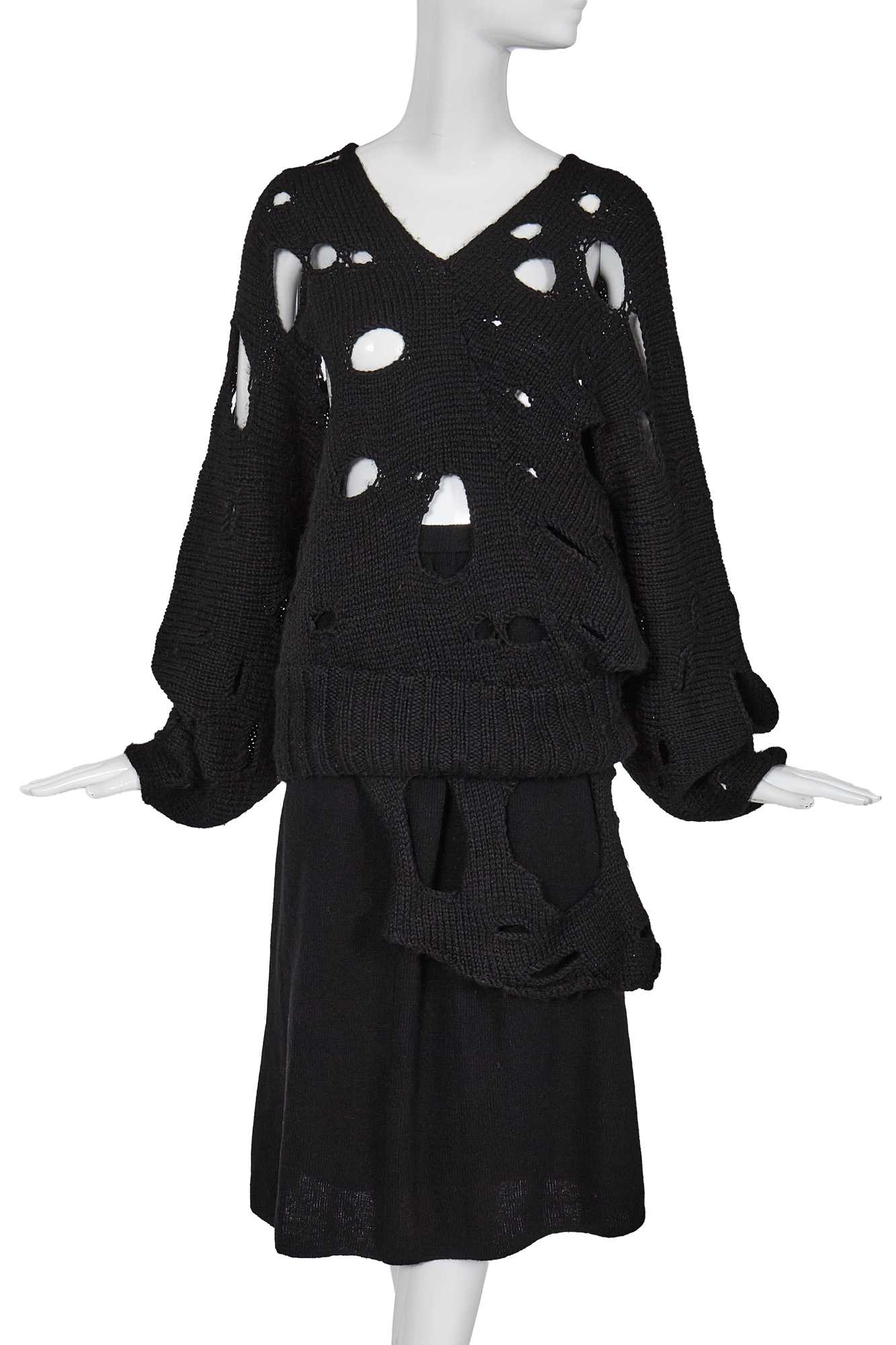 Lot 258 - An important early Comme des Garçons black knitted wool ensemble, 'Holes' collection, Autumn-Winter 1982-83