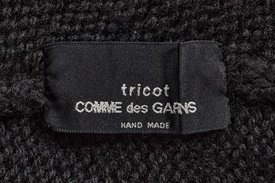 Lot 258 - An important early Comme des Garçons black knitted wool ensemble, 'Holes' collection, Autumn-Winter 1982-83