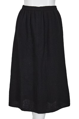 Lot 258 - An important early Comme des Garçons black knitted wool ensemble, 'Holes' collection, Autumn-Winter 1982-83