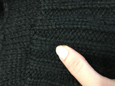 Lot 258 - An important early Comme des Garçons black knitted wool ensemble, 'Holes' collection, Autumn-Winter 1982-83