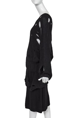 Lot 258 - An important early Comme des Garçons black knitted wool ensemble, 'Holes' collection, Autumn-Winter 1982-83