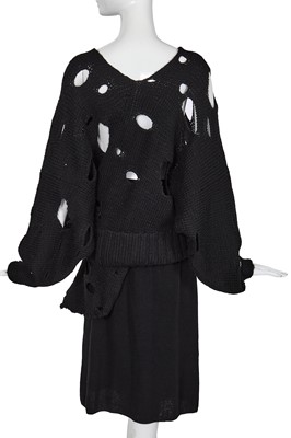 Lot 258 - An important early Comme des Garçons black knitted wool ensemble, 'Holes' collection, Autumn-Winter 1982-83