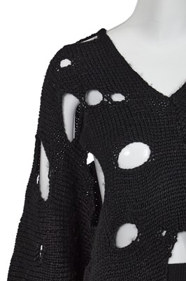 Lot 258 - An important early Comme des Garçons black knitted wool ensemble, 'Holes' collection, Autumn-Winter 1982-83