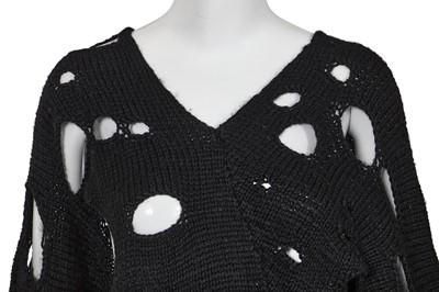 Lot 258 - An important early Comme des Garçons black knitted wool ensemble, 'Holes' collection, Autumn-Winter 1982-83