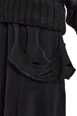 Lot 258 - An important early Comme des Garçons black knitted wool ensemble, 'Holes' collection, Autumn-Winter 1982-83
