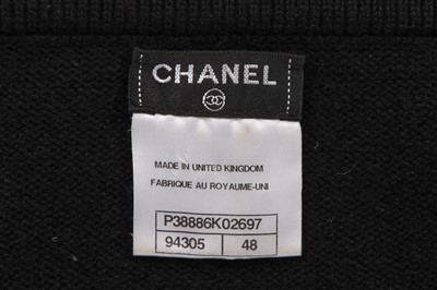 Lot 37 - A Chanel by Karl Lagerfeld black knitted cashmere jumper, 'Paris-Shanghai' collection, Métiers d'Art, Pre-Fall 2010
