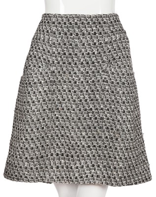 Lot 29 - A Chanel by Karl Lagerfeld black and white tweed suit, circa 2012