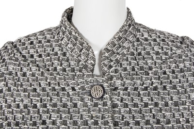Lot 29 - A Chanel by Karl Lagerfeld black and white tweed suit, circa 2012