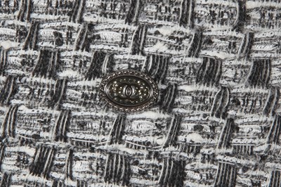 Lot 29 - A Chanel by Karl Lagerfeld black and white tweed suit, circa 2012