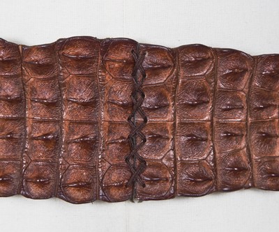 Lot 317 - An Alexander McQueen brown crocodile skin belt, Autumn-Winter 2007-08