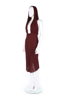 Lot 299 - An Azzedine Alaïa burgundy jersey dress,...