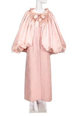 Lot 169 - A Balenciaga haute couture pale pink matelassé coat-dress and associated satin cape, Autumn-Winter 1963-64
