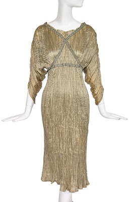 Lot 512 - A Mariano Fortuny seafoam green pleated silk Delphos dress, 1920s