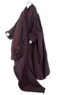Lot 331 - A Romeo Gigli dark-purple pleated cocoon coat,...