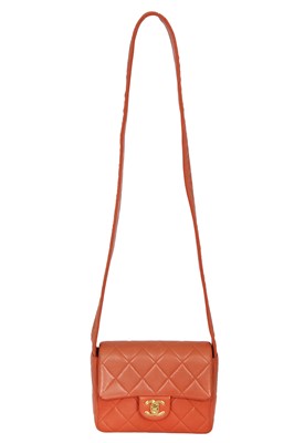 Lot 79 - A Chanel by Karl Lagerfeld quilted orange leather crossbody bag, 1996-1997