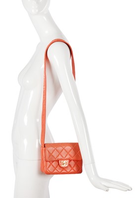 Lot 79 - A Chanel by Karl Lagerfeld quilted orange leather crossbody bag, 1996-1997