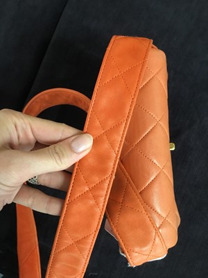 Lot 79 - A Chanel by Karl Lagerfeld quilted orange leather crossbody bag, 1996-1997