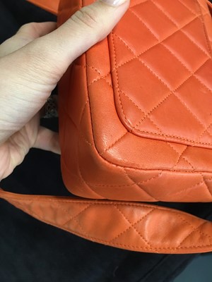 Lot 79 - A Chanel by Karl Lagerfeld quilted orange leather crossbody bag, 1996-1997