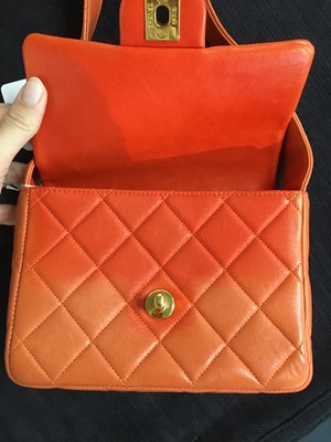 Lot 79 - A Chanel by Karl Lagerfeld quilted orange leather crossbody bag, 1996-1997