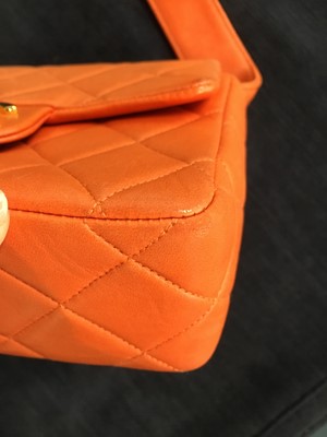 Lot 79 - A Chanel by Karl Lagerfeld quilted orange leather crossbody bag, 1996-1997