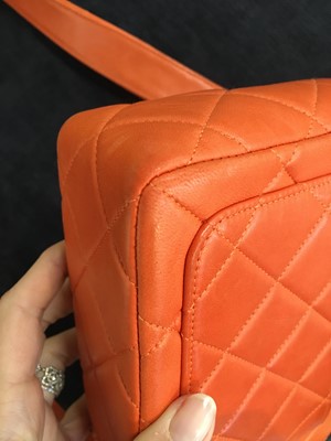 Lot 79 - A Chanel by Karl Lagerfeld quilted orange leather crossbody bag, 1996-1997