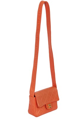 Lot 79 - A Chanel by Karl Lagerfeld quilted orange leather crossbody bag, 1996-1997