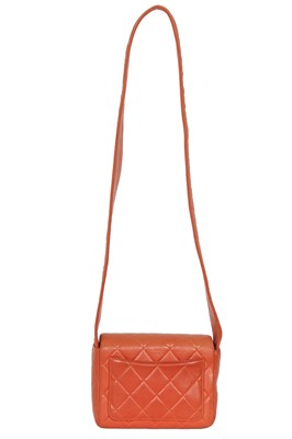 Lot 79 - A Chanel by Karl Lagerfeld quilted orange leather crossbody bag, 1996-1997