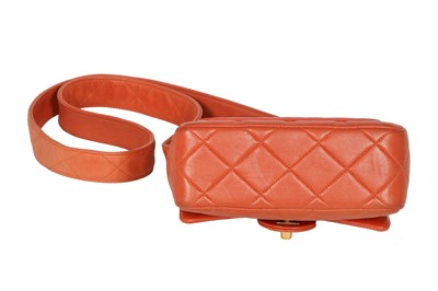 Lot 79 - A Chanel by Karl Lagerfeld quilted orange leather crossbody bag, 1996-1997