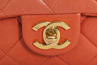 Lot 79 - A Chanel by Karl Lagerfeld quilted orange leather crossbody bag, 1996-1997