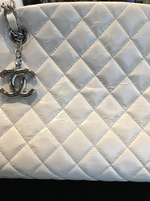 Lot 33 - A Chanel by Karl Lagerfeld white quilted patent leather shoulder bag, 2011