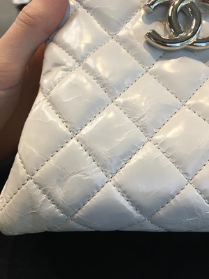 Lot 33 - A Chanel by Karl Lagerfeld white quilted patent leather shoulder bag, 2011