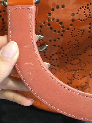 Lot 65 - A Chanel by Karl Lagerfeld punched orange patent leather tote, 2005-2006