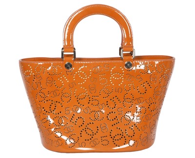 Lot 65 - A Chanel by Karl Lagerfeld punched orange patent leather tote, 2005-2006