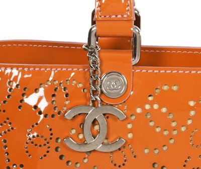 Lot 65 - A Chanel by Karl Lagerfeld punched orange patent leather tote, 2005-2006